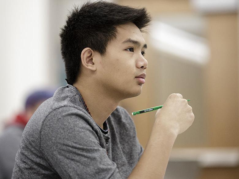 Student listening to a lecture in class